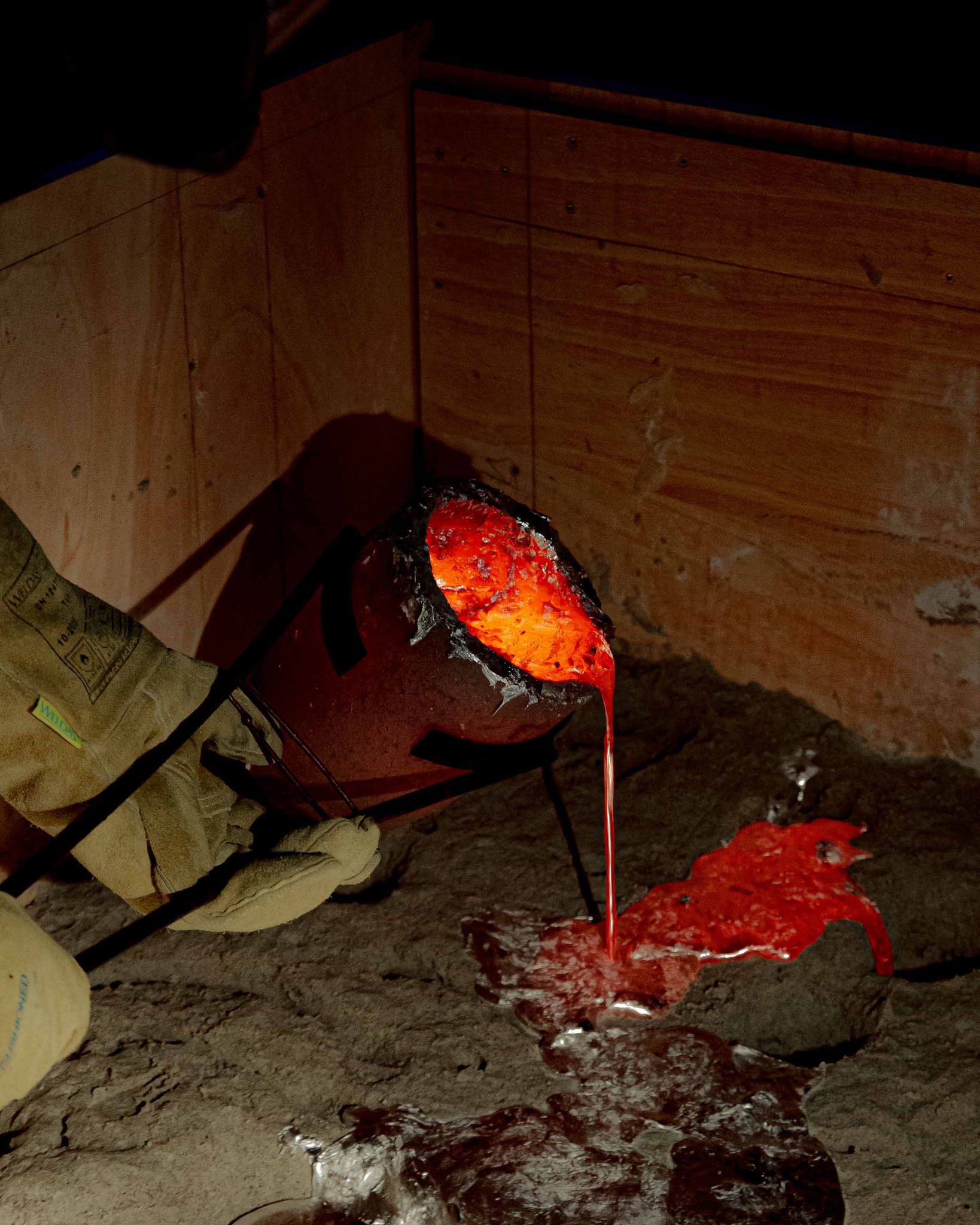 Casting event — pouring molten aluminium close-up