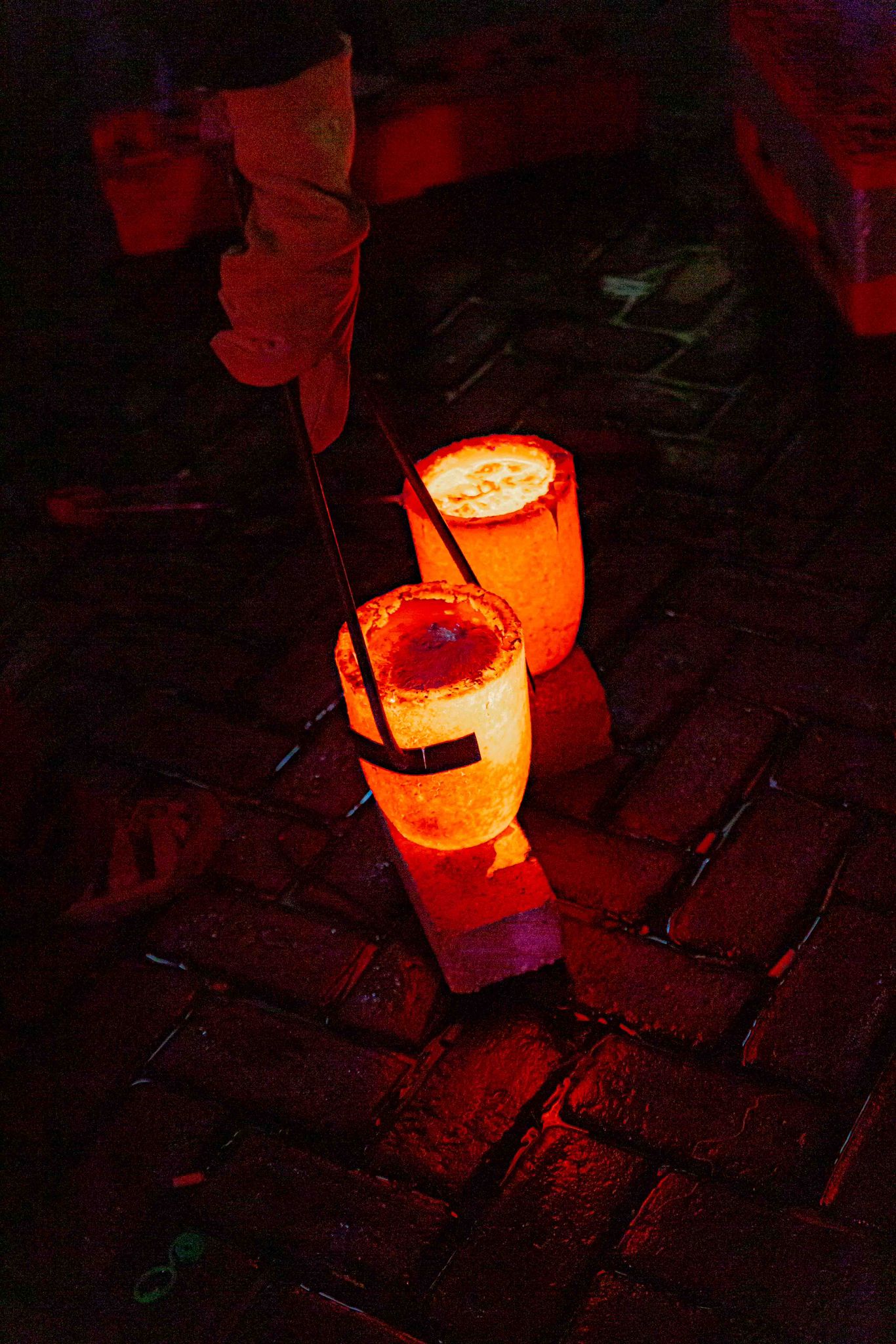 Casting event — glowing crucibles of molten aluminium